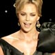 Charlize Theron presents the Oscar award for best documentary feature at the 78th annual Academy Awards