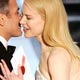 Clooney kisses Kidman after being awarded best supporting actor at the 78th annual Academy Awards