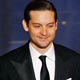 Kirsten Dunst and Tobey Maguire walk on stage to present Oscar for original screenplay at the 79th Annual Academy Awards in Hollywood