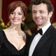 British actor Sheen and his girlfriend Stewart pose for photographers on the red carpet at the 81st Academy Awards in Hollywood