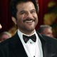 Indian actors Freida Pinto and Anil Kapoor of `Slumdog Millionaire` laugh on red carpet at 81st Academy Awards in Hollywood