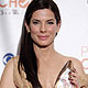 Actress Sandra Bullock poses with her favorite movie actress award at the 2010 People`s Choice Awards in Los Angeles