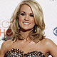 Singer Carrie Underwood poses with her award for favorite country artist at the 2010 People`s Choice Awards in Los Angeles