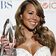 Mariah Carey poses with her award at the 2010 People`s Choice Awards in Los Angeles