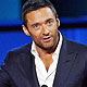 Hugh Jackman accepts award from presenter Taraji P. Henson at the 2010 People`s Choice Awards in Los Angeles