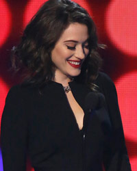 Show hosts and actresses Kat Dennings (L) and Beth Behrs perform a comedy bit at the 2014 People's Choice Awards in Los Angeles, California