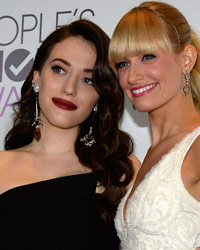 Show hosts Kat Dennings and Beth Behrs pose backstage at the 2014 People's Choice Awards in Los Angeles, California