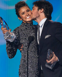 Nina Dobrev and Ian Somerhalder accept the award for favorite on-screen chemistry for their show 'The Vampire Diaries' at the 2014 People's Choice Awards in Los Angeles, California