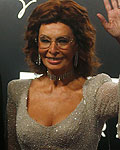 Pirelli's President Marco Tronchetti Provera and Italian actress Sophia Loren pose during the arrivals for the launch of the Pirelli Calendar 2013 in Rio de Janei