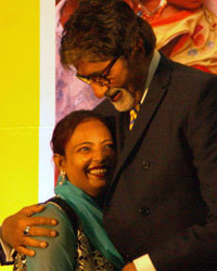 UNICEF Goodwill Ambassador Amitabh Bachchan gets a hug from a polio volunteer