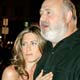 Jennifer Aniston, star of the comedy film 'Rumor has it...', poses with director Rob Reiner on the red carpet during the film's premiere in Hollywood