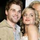 Mena Suvari, star of the comedy film 'Rumor Has It...' poses with cast member Mike Vogel at the film's premiere in Hollywood