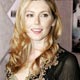 Actress Diora Baird from the film 'Wedding Crashers' poses as she arrives as a guest for the premiere of the new film 'Annapolis' in Hollywood