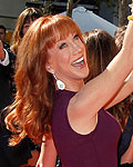 Kathy Griffin mimics the pose of the Emmy statue at the 2012 Primetime Creative Arts Emmy Awards in Los Angeles