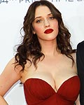 Actress Kat Dennings, of the comedy series 'Two Broke Girls,' and actor Nick Zano arrive at the 64th Primetime Emmy Awards in Los Angeles