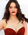 Actress Kat Dennings, of the comedy series 'Two Broke Girls,' arrives at the 64th Primetime Emmy Awards in Los Angeles