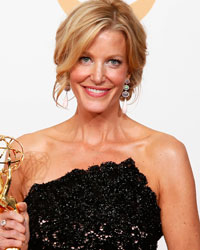 Actress Anna Gunn from AMC's series 'Breaking Bad' poses backstage with her award for Outstanding Supporting Actress In A Drama Series at the 65th Primetime Emmy Awards in Los Angeles