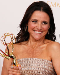 Actress Julia Louis-Dreyfus and actor Tony Hale of HBO's series 'Veep' pose backstage with their awards for Best Actress in a Comedy Series and Best Supporting Actor in a Comedy Series at the 65th Primetime Emmy Awards in Los Angeles