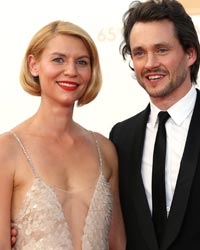 Actress Claire Danes from Showtime's series 'Homeland' arrives with husband Hugh Dancy at the 65th Primetime Emmy Awards in Los Angeles