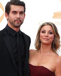 Actress Kaley Cuoco from the Big Bang theory with Ryan Sweeting (L) arrive at the 65th Primetime Emmy Awards in Los Angeles