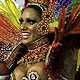 A reveller from the Mocidade samba school parades on the first night of the annual Carnival parade in Rio de Janeiro's Sambadrome