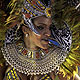 A reveller from the Vila Isabel samba school parades on the first night of the annual Carnival parade in Rio de Janeiro's Sambadrome