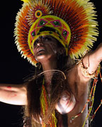 A reveller from Imperatriz Leopoldinense samba school participates during the annual carnival parade in Rio de Janeiro's Sambadrome