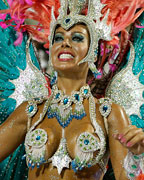 A reveller from the Mangueira samba school participates during the annual carnival parade in Rio de Janeiro's Sambadrome