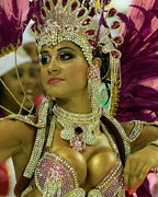 A reveller from the Mangueira samba school participates during the annual carnival parade in Rio de Janeiro's Sambadrome