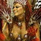 A reveller of the Salgueiro samba school dances atop a float during the first night of parades by the top samba groups in Rio de Janeiro`s Sambadrome