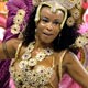 A reveller from the Sao Clemente samba school dances during the first night of parades by the top samba groups in Rio de Janeiro`s Sambadrome