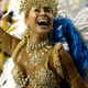 A carnival reveller dances during the first night of parades by the top samba groups in Rio de Janeiro`s Sambadrome