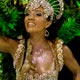 A reveller from the Sao Clemente samba school dances during the first night of parades by the top samba groups in Rio de Janeiro`s Sambadrome