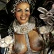 A reveller of the Porto da Pedra samba school dances atop a float during the first night of parades by the top samba groups in Rio de Janeiro`s Sambadrome