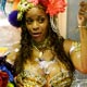 A reveler of the Mangueira samba school dances atop a float during the first night of parade by top samba groups in Rio de Janeiro`s Sambadrome