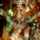 A reveler of the Portela samba school dances atop a float during the first night of parade by top samba groups in Rio de Janeiro`s Sambadrome