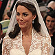 Britain's Prince William, and Kate Middleton exchange rings before the Archbishop of Canterbury, Rowan Williams, during their wedding ceremony In Westminster Abbey, in central London