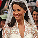 Britain's Prince William, and Kate Middleton stand before the Archbishop of Canterbury, Rowan Williams, during their wedding ceremony In Westminster Abbey, in central London