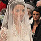 Britain's Prince William stands at the altar with his bride, Kate Middleton, and her father Michael, during their wedding at Westminster Abbey in central London