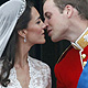 Britain's Prince William and his wife Catherine, Duchess of Cambridge, are seen before they kiss on the balcony at Buckingham Palace after their wedding in Westminster Abbey, in central London