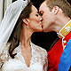 Britain's Prince William and his wife Catherine, Duchess of Cambridge kiss on the balcony of Buckingham Palace