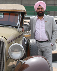 JD Ghai posing with Chevrolet 1933