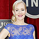 Penelope Ann Miller poses as she arrives at the 18th annual Screen Actors Guild Awards in Los Angeles