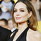 Brad Pitt from and actress Angelina Jolie pose on arrival at the 18th annual Screen Actors Guild Awards in Los Angeles