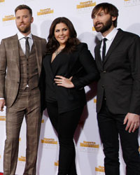 Kate Upton (C, in black dress) and members of Lady Antebellum Charles Kelley (3rd R), Hillary Scott (2nd R) and Dave Haywood (R) arrive for the 50 Years of Beautiful broadcast special show celebrating the 50th anniversary of the Sports Illustrated Swimsuit Issue at the Dolby Theater in Los Angeles, California