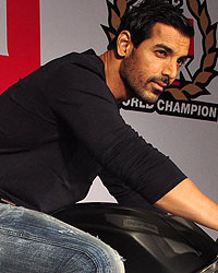 John Abraham poses with his new super bike Aprilia RSV4