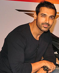 John Abraham poses with his new super bike Aprilia RSV4