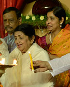 Hridaynath, Lata Mangeshkar and other dignitaries light the lamp at the inauguration of the Vishwashanti Sangeet Kala Academy