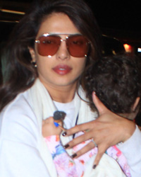 Nick Jonas and Priyanka Chopra with daughter anapped at airport