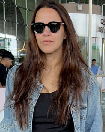 Neha Dhupia snapped at the airport.